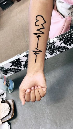 We've Decided Drake's Emoji Tattoo Is Prayer Hands and Not a High-Five