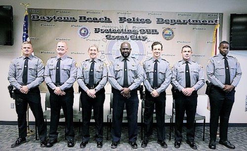 Slain Daytona officer's patrol car signed with messages of honor