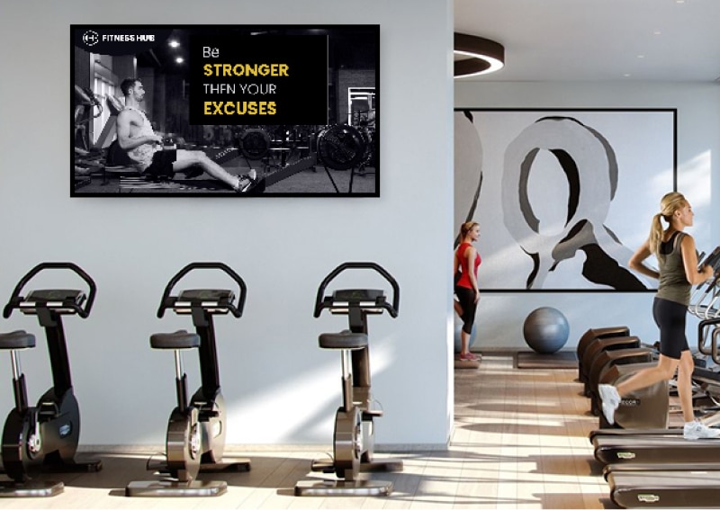Digital signage display featuring motivational quotes in gyms